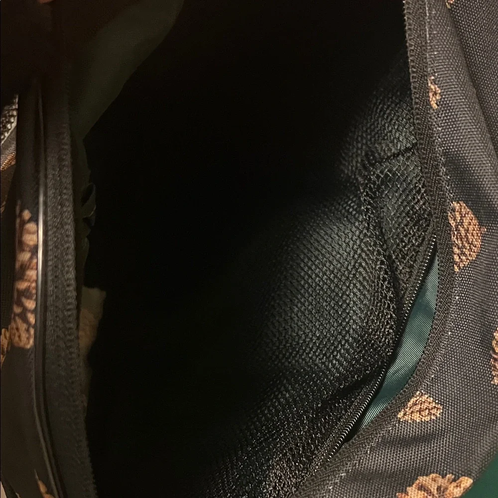 Kavu Pinecone Print Sling Backpack in Black and Brown